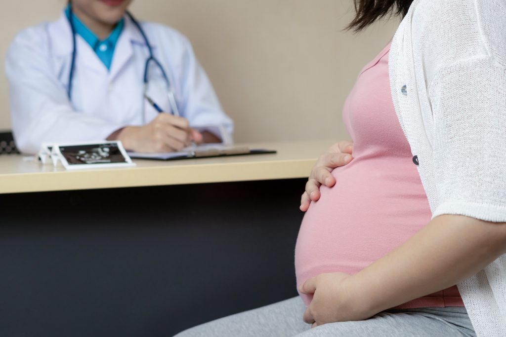 Pregnant Woman and Gynecologist Doctor at Hospital